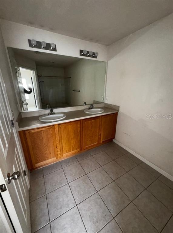 4202 Southwest 55th Circle, Unit C Ocala, FL 34474 - Photo 8 of 15 a room with washing machine