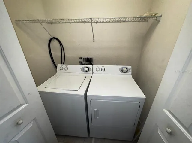 a utility room with dryer and washer