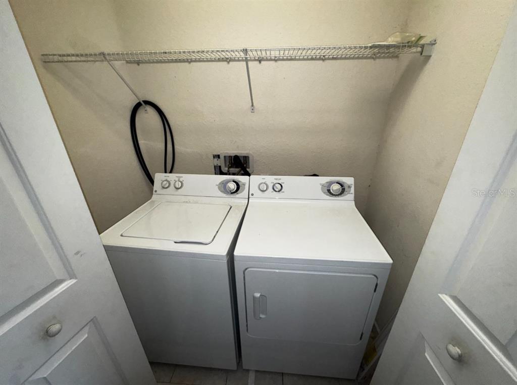 4202 Southwest 55th Circle, Unit C Ocala, FL 34474 - Photo 10 of 15 a utility room with dryer and washer