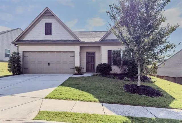 a front view of a house with garden