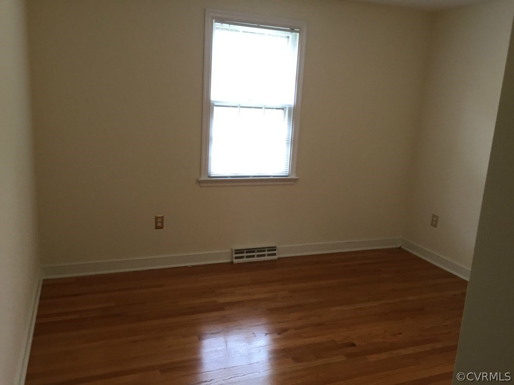 50 Arkwright Road North Chesterfield, VA 23236 - Photo 2 of 16 an empty room with wooden floor and a window