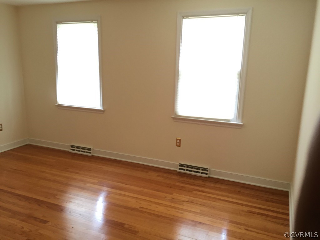 50 Arkwright Road North Chesterfield, VA 23236 - Photo 3 of 16 an empty room with wooden floor and a window
