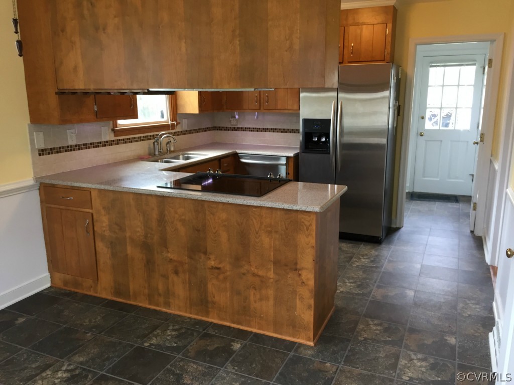 50 Arkwright Road North Chesterfield, VA 23236 - Photo 9 of 16 a kitchen with stainless steel appliances granite countertop a refrigerator and a sink