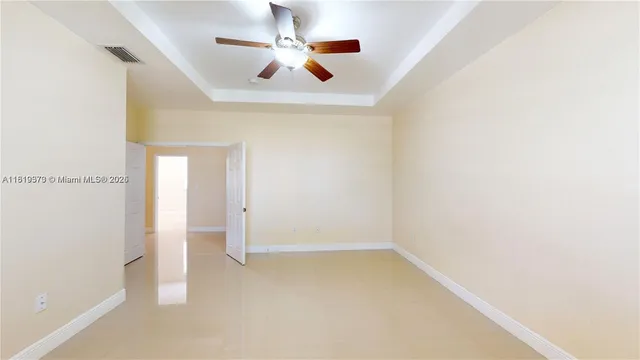 a bathroom with a glass shower door and a bathtub