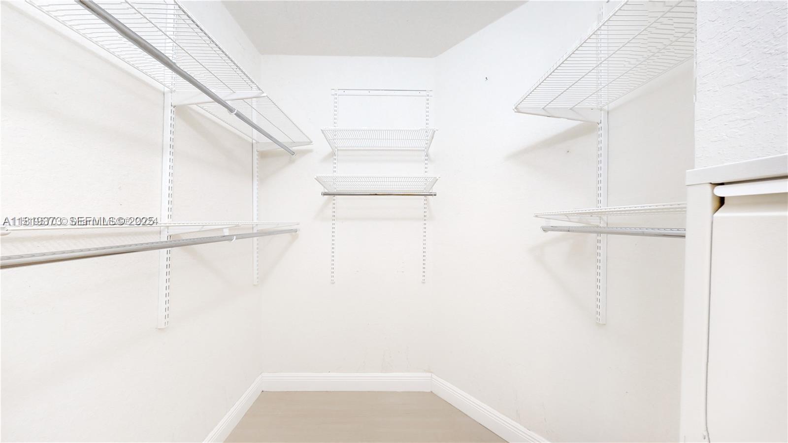 12281 Southwest 121st Terrace Miami, FL 33186 - Photo 23 of 58 a view of small space with racks on the wall