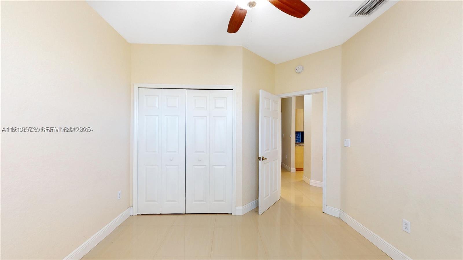 12281 Southwest 121st Terrace Miami, FL 33186 - Photo 25 of 58 a view of an empty room