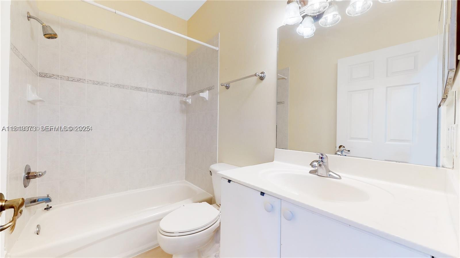 12281 Southwest 121st Terrace Miami, FL 33186 - Photo 32 of 58 a bathroom with a sink a toilet and shower