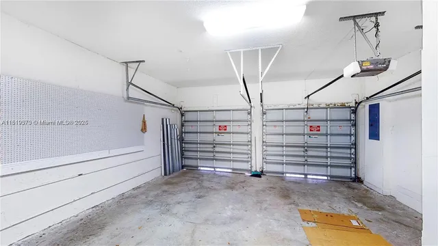 a view of a house with a patio and a yard