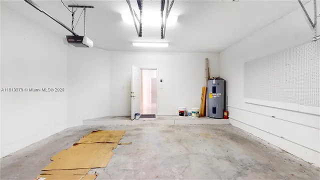 a view of a cafe with a couple of people seating on table and chairs