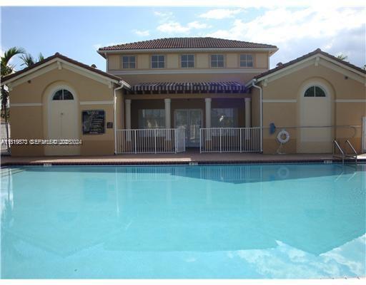 12281 Southwest 121st Terrace Miami, FL 33186 - Photo 4 of 58 a front view of a house with a yard