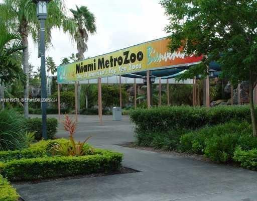 12281 Southwest 121st Terrace Miami, FL 33186 - Photo 42 of 58 a view of a cafe with a couple of people seating on table and chairs