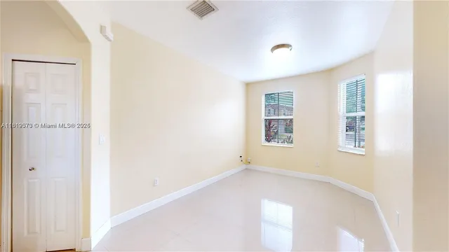 a view of a hallway with a white walls