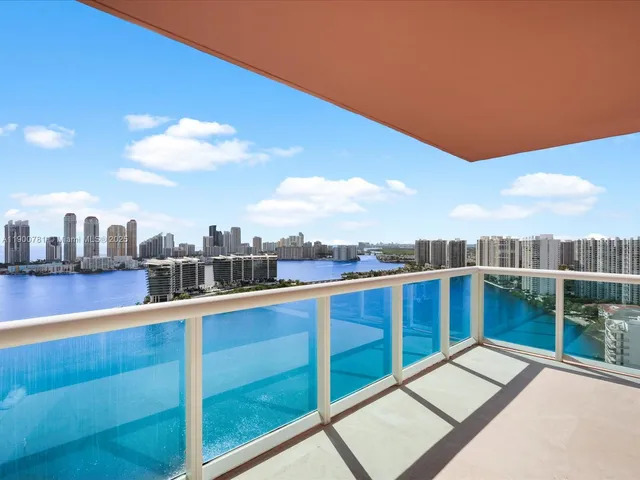 a view of swimming pool with outdoor seating and city view