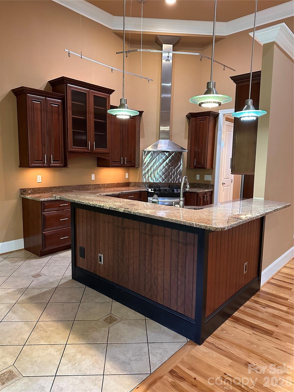 26 Stone House Road Arden, NC 28704 - Photo 6 of 21 a kitchen with stainless steel appliances granite countertop a sink and a wooden cabinets