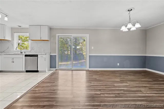 a bedroom with a bed dresser and a window