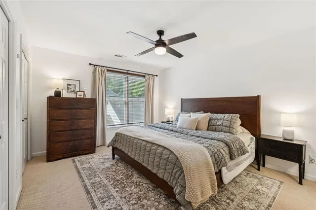 a bedroom with a bed and a dresser