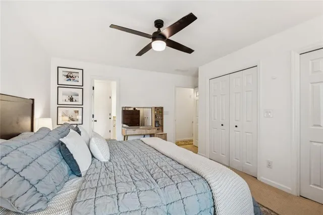 a bedroom with a bed and flat screen tv