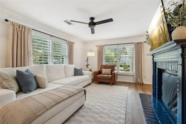 a living room with furniture and a fireplace