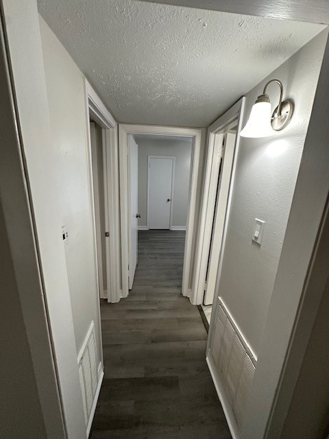 3400 Timmons Lane, Unit 24 Houston, TX 77027 - Photo 11 of 21 a view of hallway with stairs and wooden floor