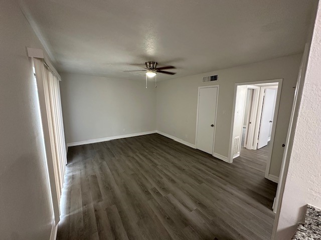 3400 Timmons Lane, Unit 24 Houston, TX 77027 - Photo 13 of 21 an empty room with wooden floor and windows