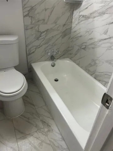 a bathroom with a toilet and a sink