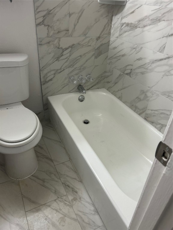 3400 Timmons Lane, Unit 24 Houston, TX 77027 - Photo 2 of 21 a bathroom with a toilet and a sink