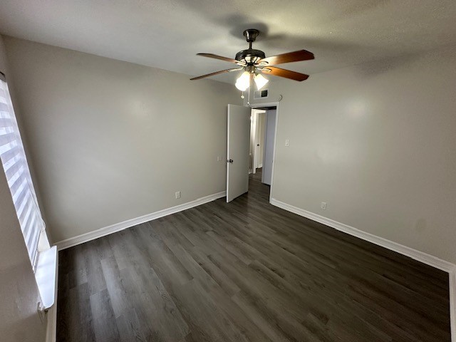 3400 Timmons Lane, Unit 24 Houston, TX 77027 - Photo 5 of 21 an empty room with wooden floor fan and window