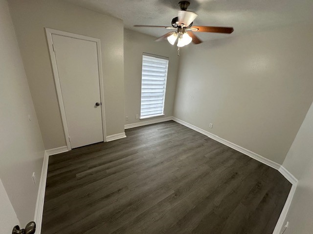 3400 Timmons Lane, Unit 24 Houston, TX 77027 - Photo 7 of 21 an empty room with wooden floor fan and windows