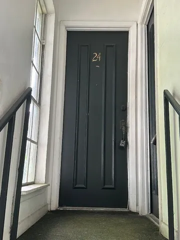 a kitchen with granite countertop a sink and a stove top oven