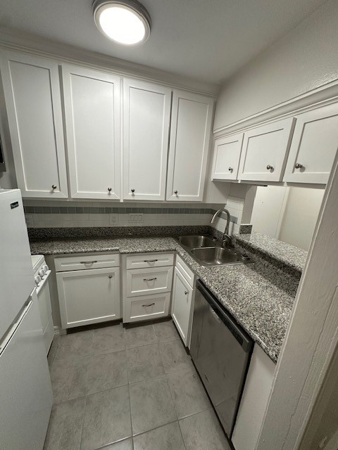 3400 Timmons Lane, Unit 24 Houston, TX 77027 - Photo 9 of 21 a kitchen with granite countertop a sink and a stove top oven