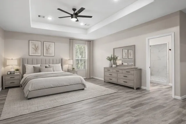 a bedroom with a bed and a chandelier