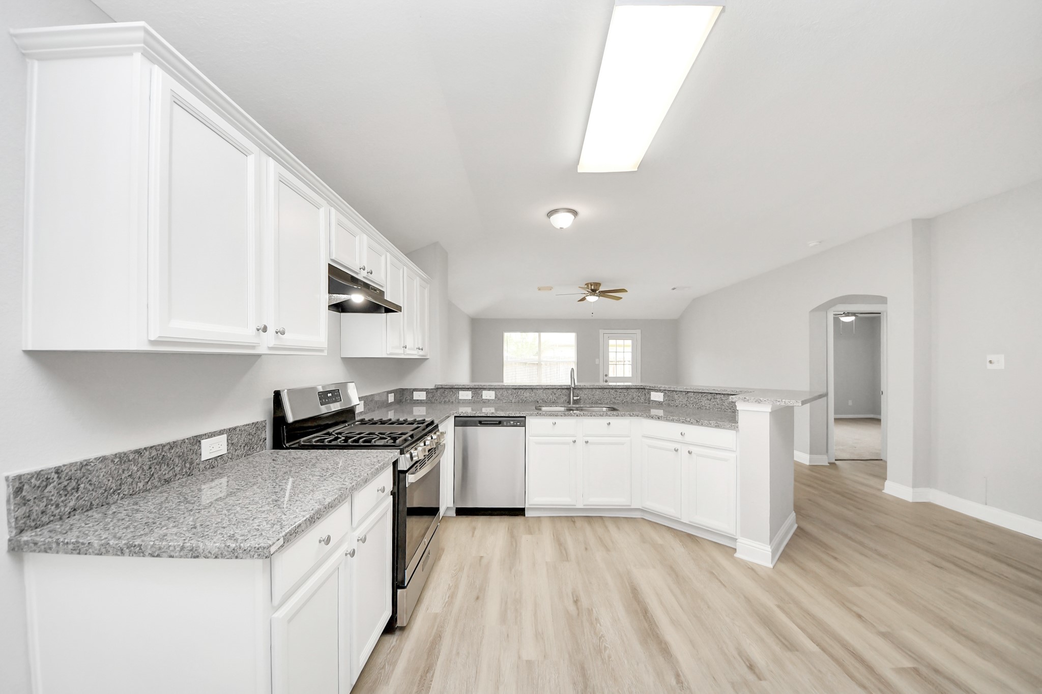 19618 Beachy Court Katy, TX 77449 - Photo 11 of 33 Here’s another look at the kitchen, showcasing its open and modern feel!