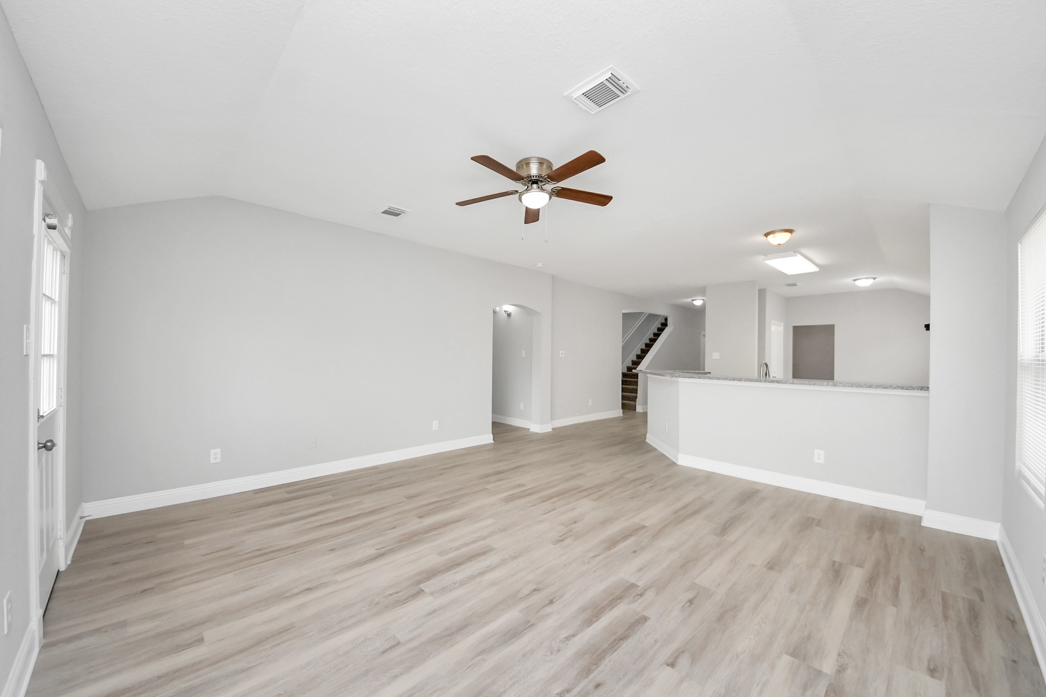 19618 Beachy Court Katy, TX 77449 - Photo 13 of 33 With its expansive open layout, this living room seamlessly blends style and functionality, offering endless possibilities for arranging your space!