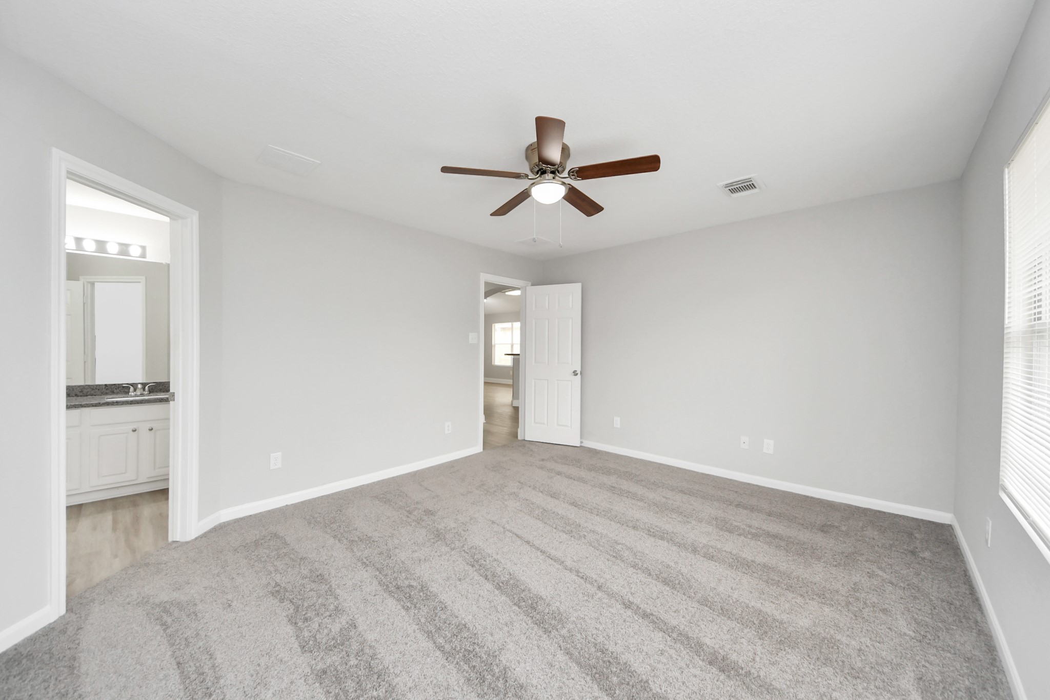 19618 Beachy Court Katy, TX 77449 - Photo 15 of 33 The large primary bedroom provides the ideal balance of space and tranquility, offering a peaceful escape from the rest of the home!