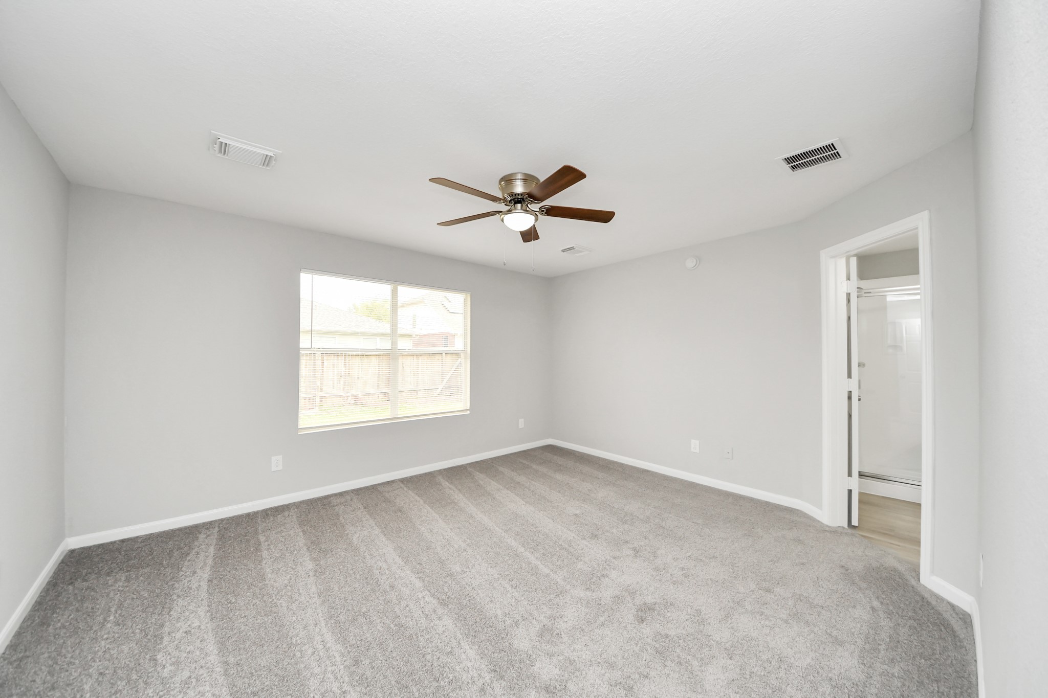 19618 Beachy Court Katy, TX 77449 - Photo 16 of 33 A different perspective of the primary bedroom, showcasing its spacious layout!
