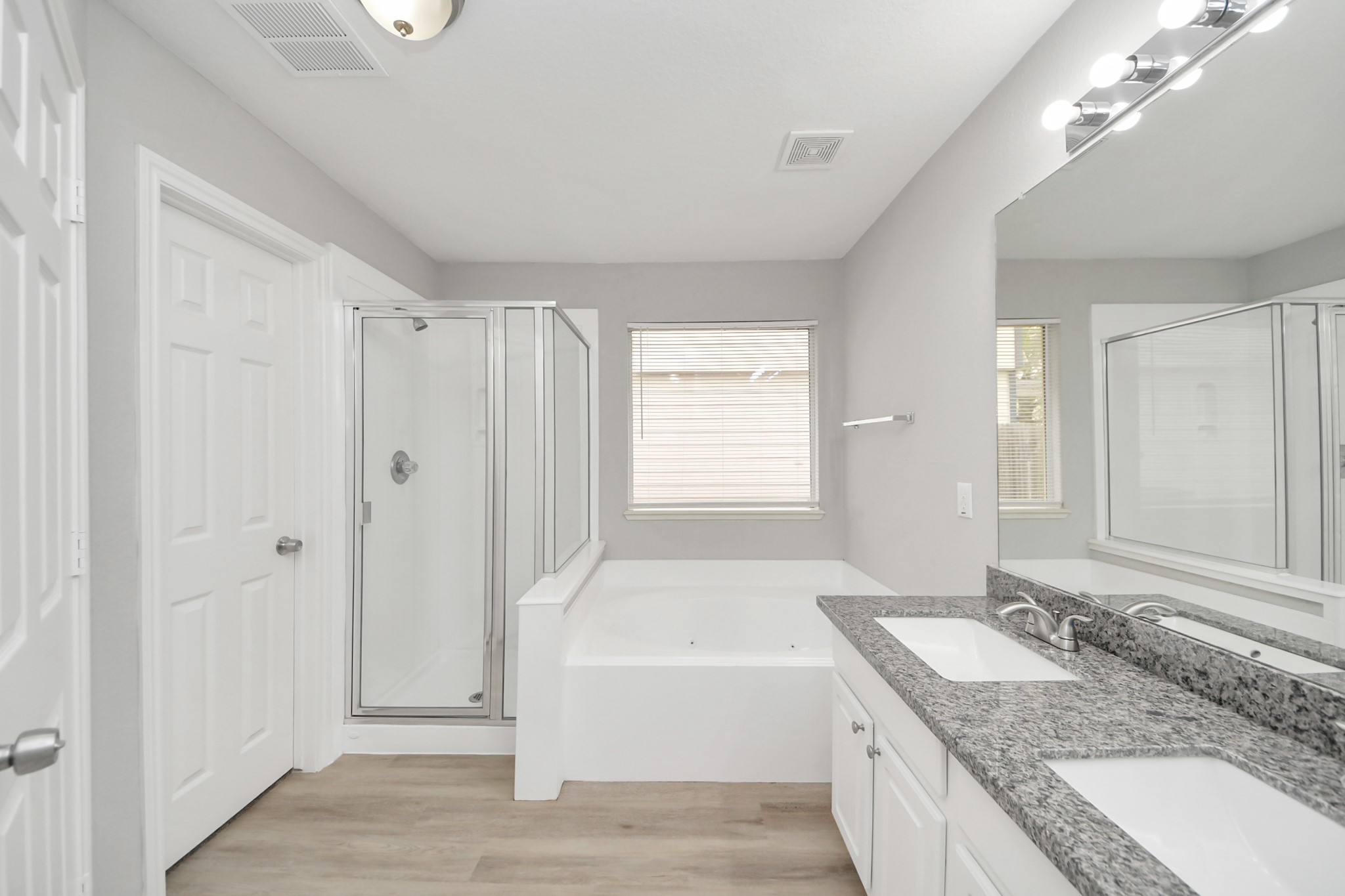 19618 Beachy Court Katy, TX 77449 - Photo 17 of 33 The primary bathroom features a beautiful walk-in shower and a separate tub combo, offering the perfect space to relax and unwind!