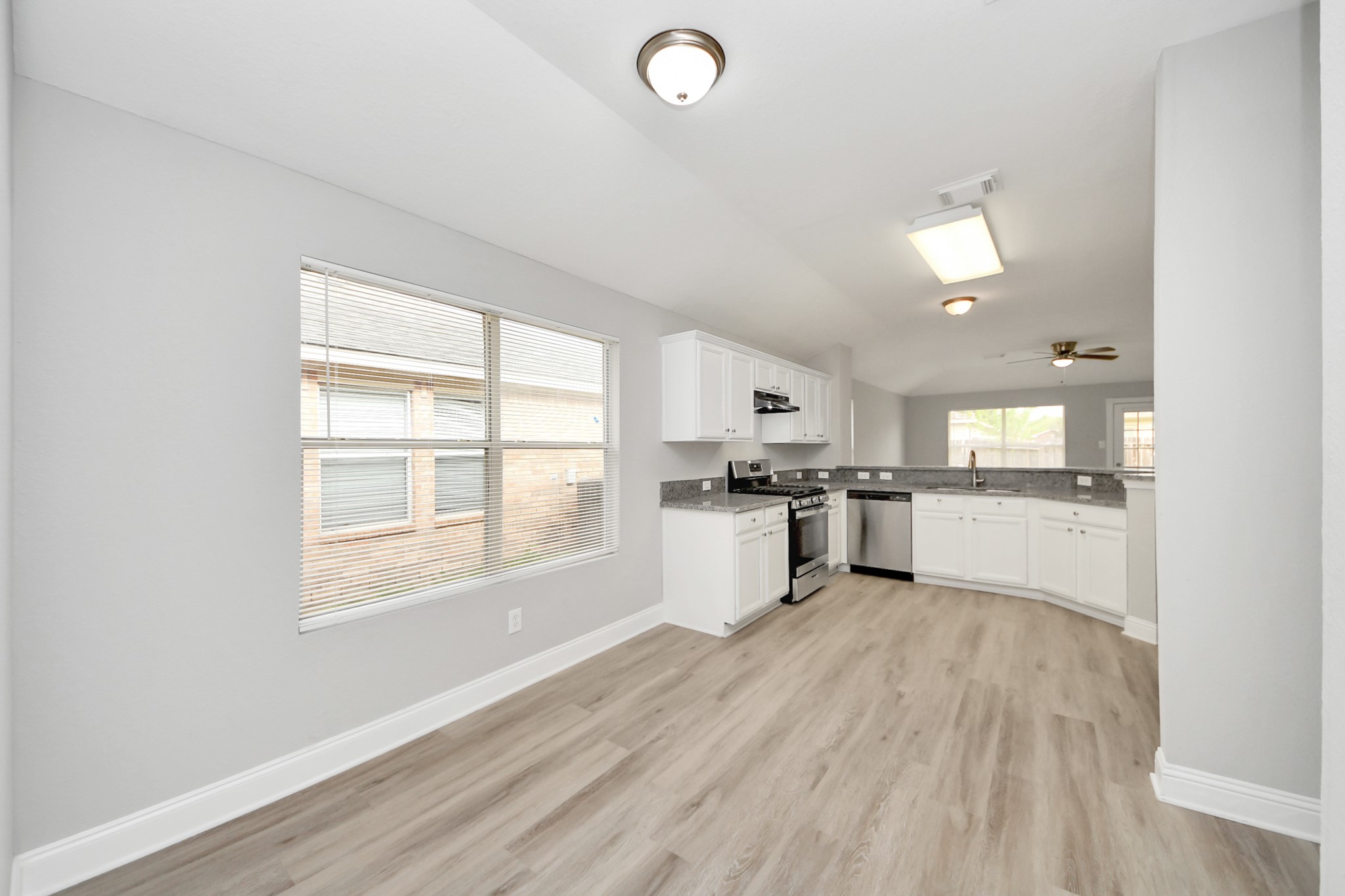 19618 Beachy Court Katy, TX 77449 - Photo 7 of 33 Step into this bright kitchen, where you’ll find plenty of room for a cozy breakfast nook—perfect for starting your day!