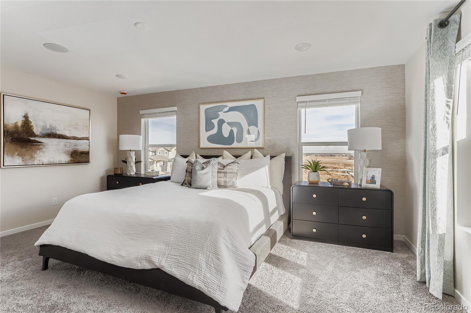 13342 Front Porch Firestone, CO 80504 - Photo 14 of 27 a spacious bedroom with a bed and window