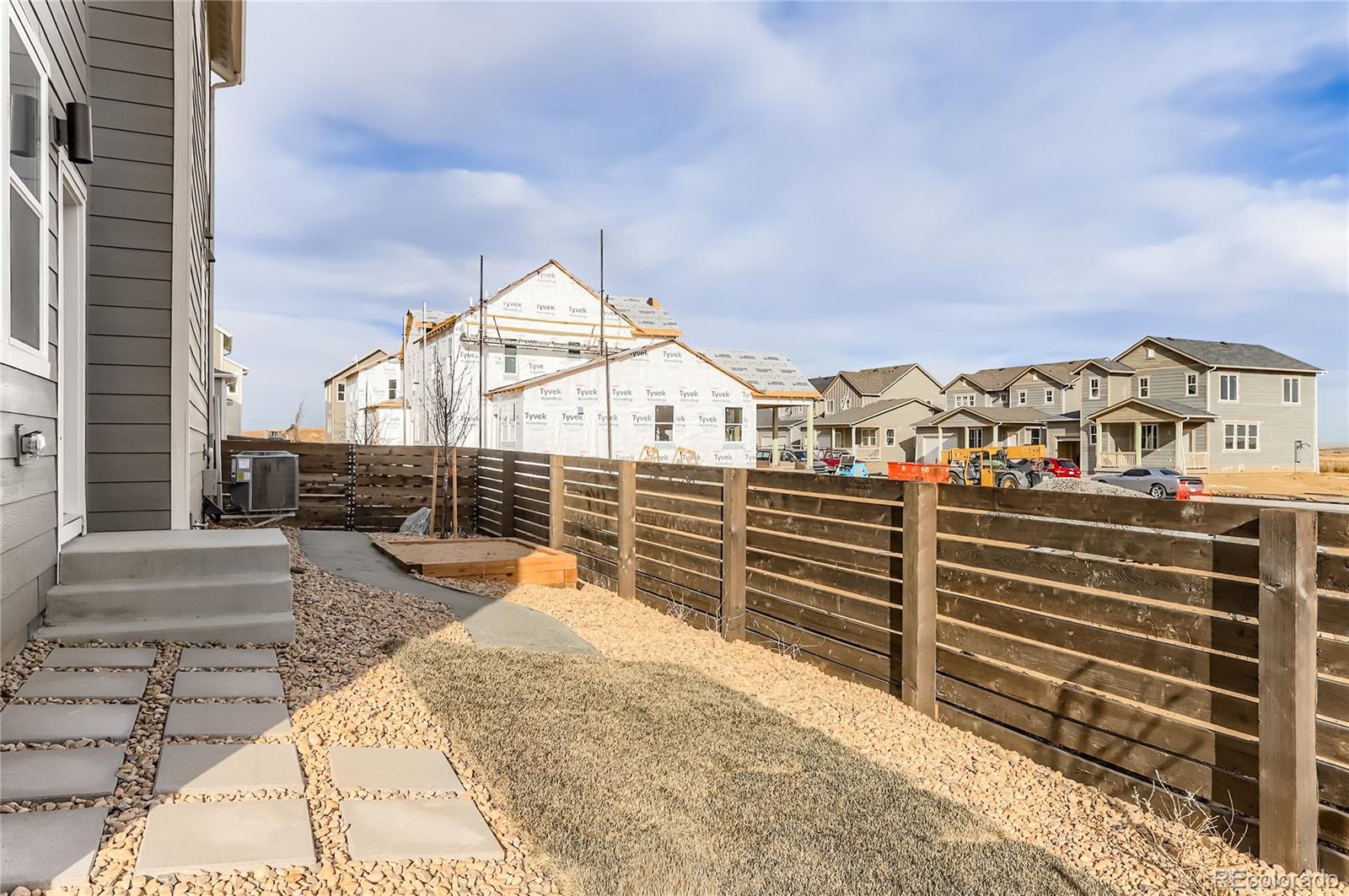 13342 Front Porch Firestone, CO 80504 - Photo 23 of 27 a view of a large building with a outdoor space