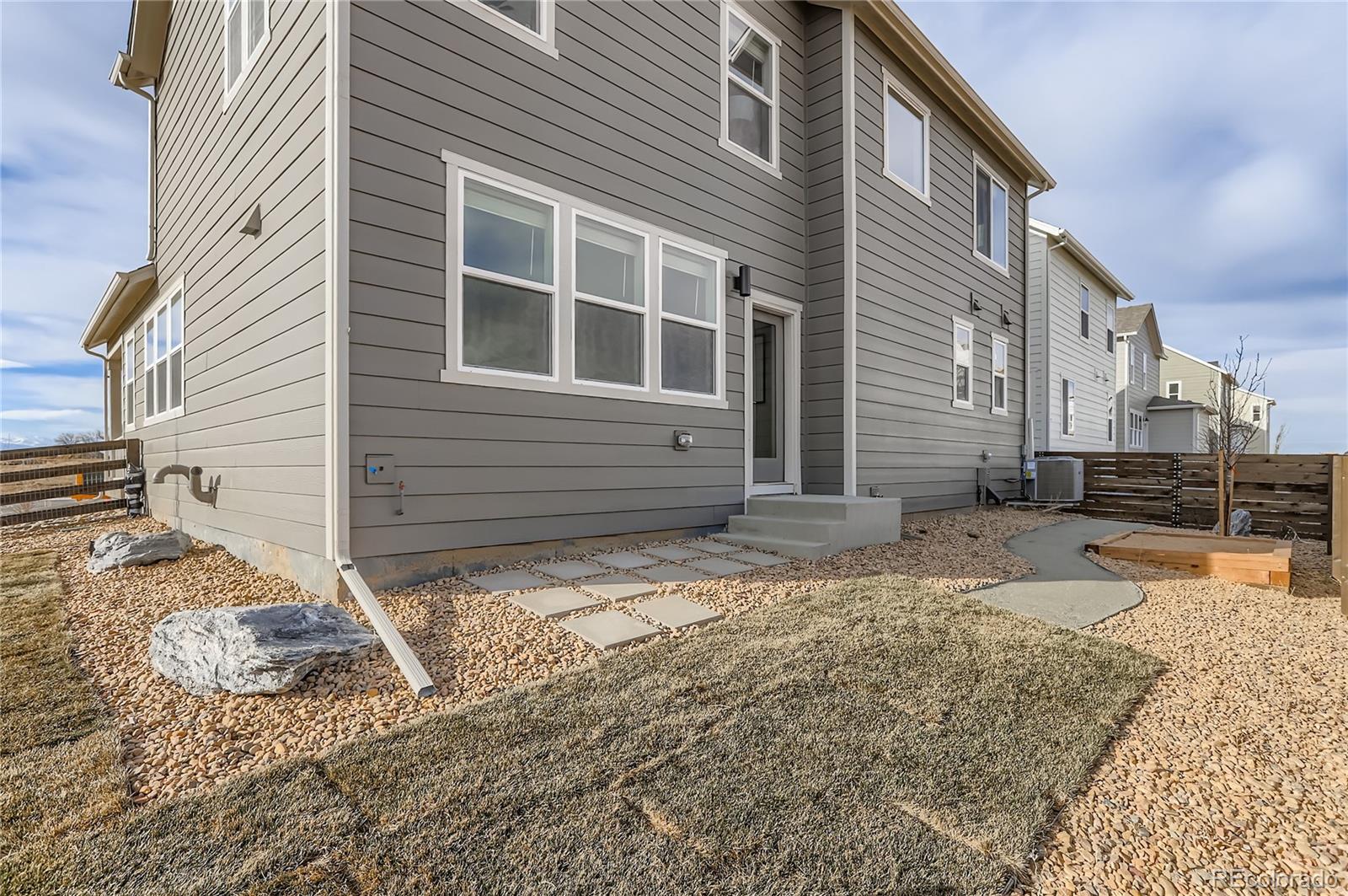 13342 Front Porch Firestone, CO 80504 - Photo 24 of 27 a view of a house with a yard