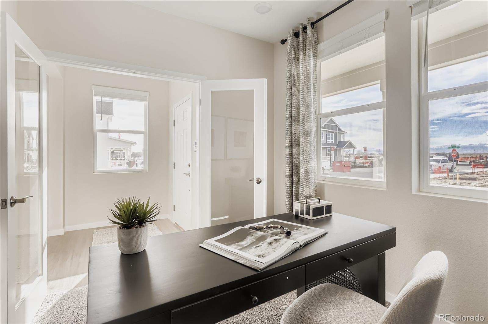 13342 Front Porch Firestone, CO 80504 - Photo 6 of 27 a living room with furniture and a potted plant