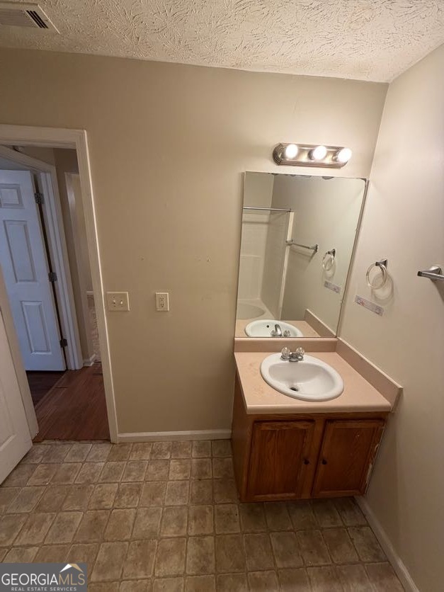 5196 Tew Lane Southwest Covington, GA 30014 - Photo 15 of 41 a bathroom with a sink and a mirror