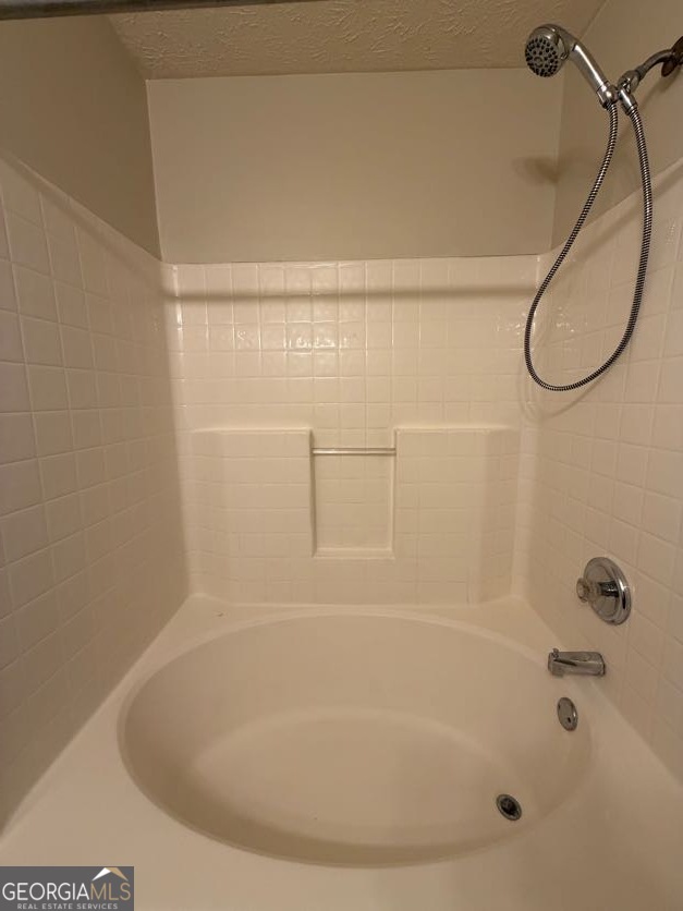 5196 Tew Lane Southwest Covington, GA 30014 - Photo 16 of 41 a bathroom with a shower