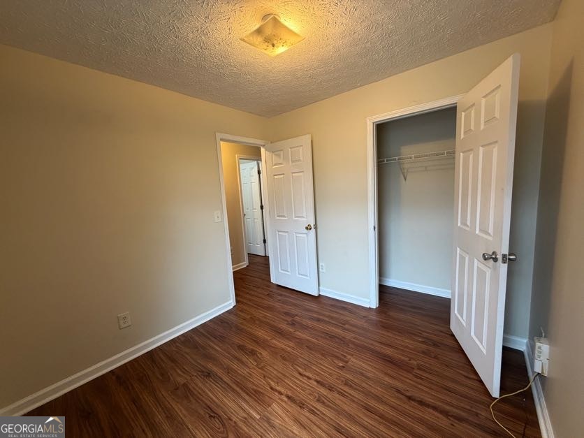 5196 Tew Lane Southwest Covington, GA 30014 - Photo 26 of 41 a view of a hallway with wooden floor