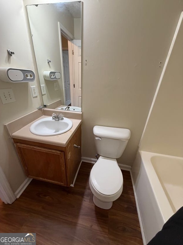 5196 Tew Lane Southwest Covington, GA 30014 - Photo 27 of 41 a white toilet sitting next to a bathroom sink