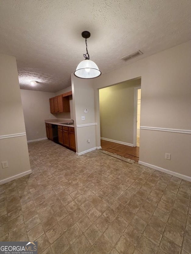 5196 Tew Lane Southwest Covington, GA 30014 - Photo 6 of 41 a view of empty room with a sink and chandelier