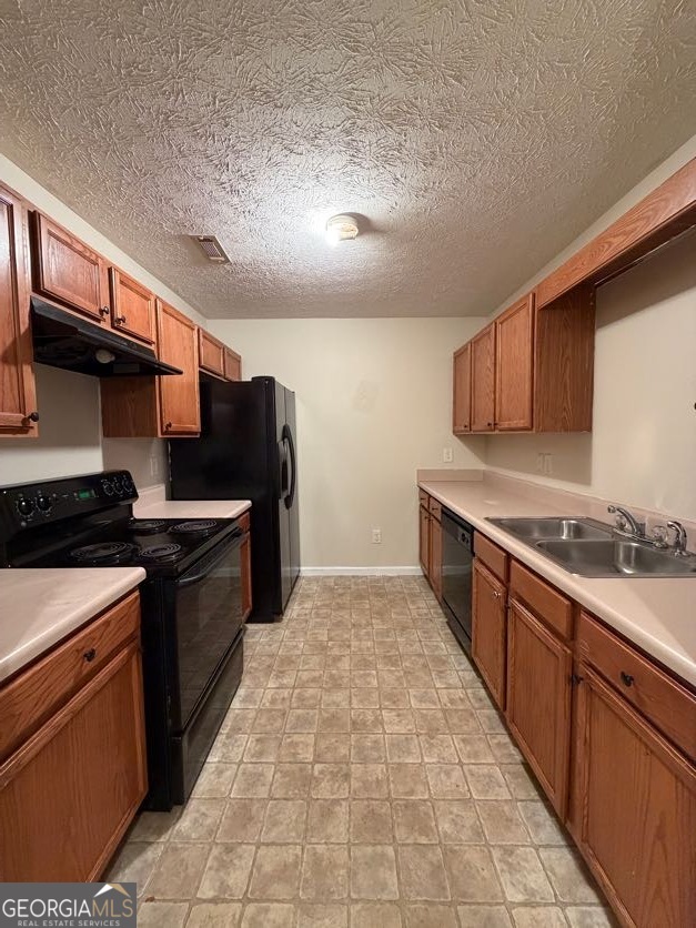 5196 Tew Lane Southwest Covington, GA 30014 - Photo 7 of 41 a large kitchen with stainless steel appliances granite countertop a stove and a sink
