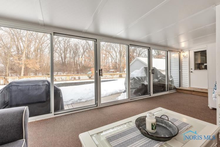 3014 Gradwohl Road Toledo, OH 43617 - Photo 32 of 39 Enclosed porch with sliders to deck.