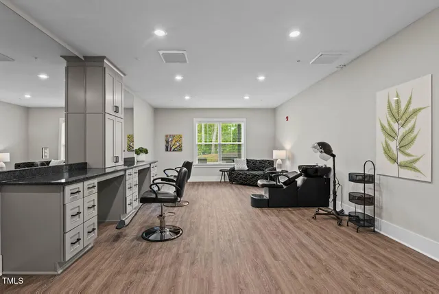 a living room with furniture window and wooden floor