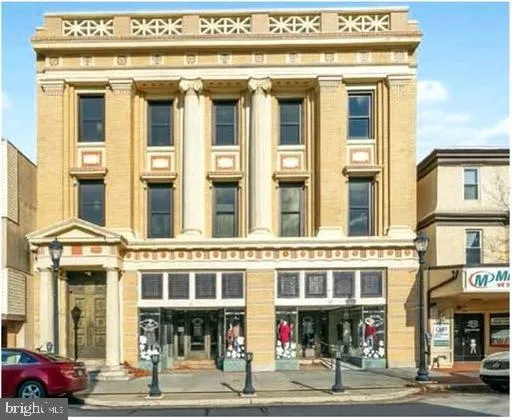 a view of a building with a street